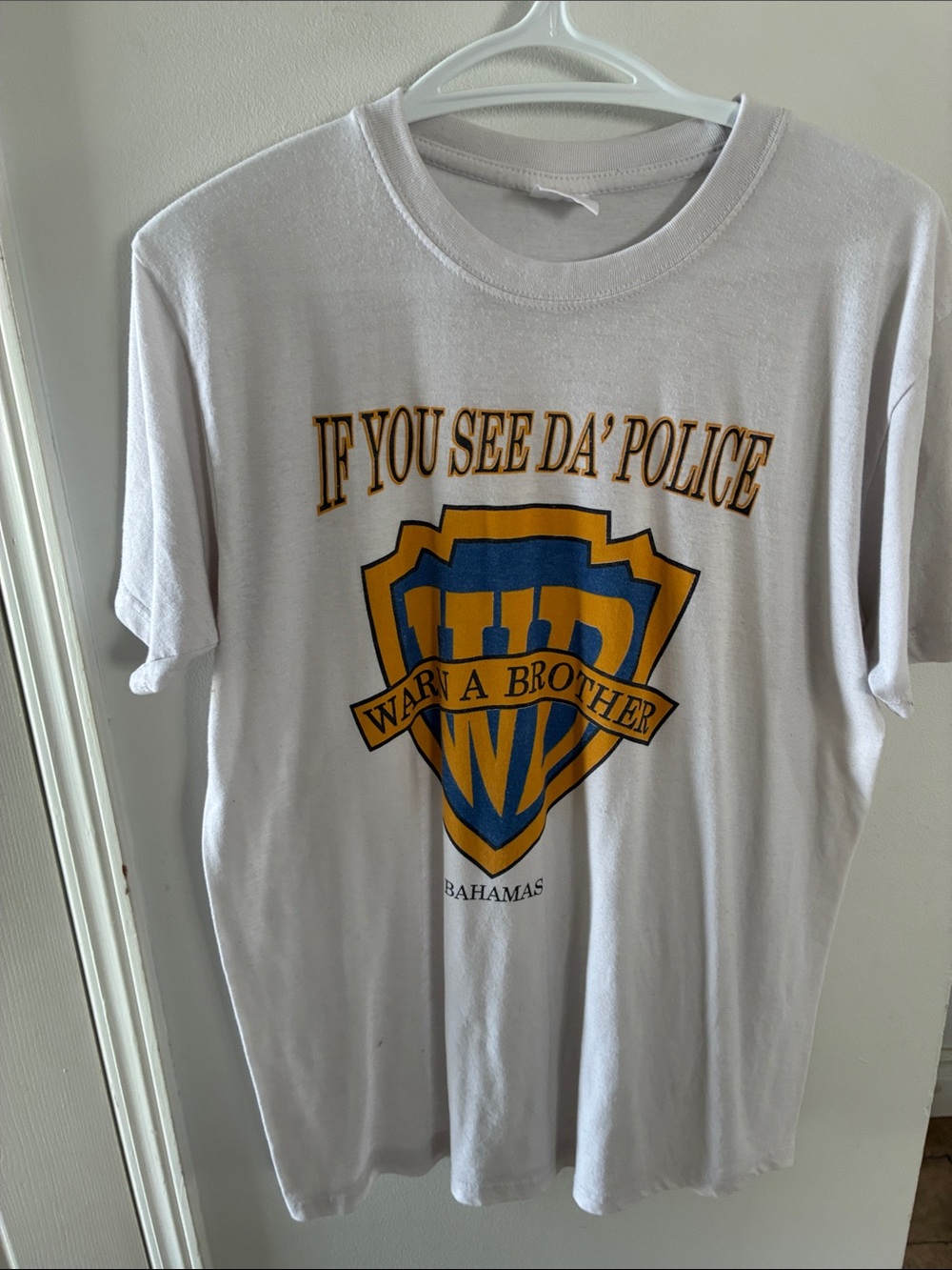 White Graphic Tee with Yellow & Blue Shield Print